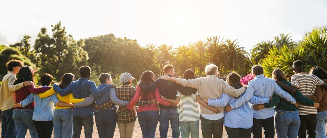 group of people locking arms standing together